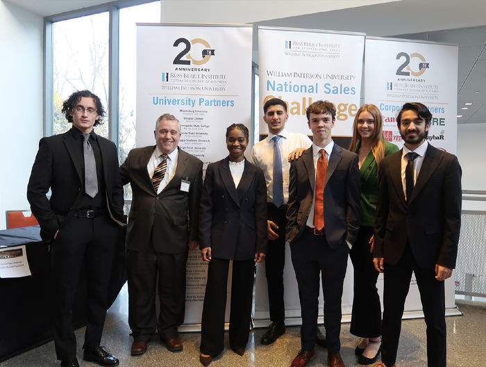 Mary Odei poses with a group at the National Sales Challenge competition
