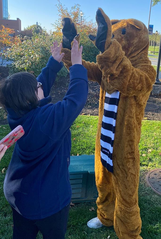 High fives from the Lion at the welcome event