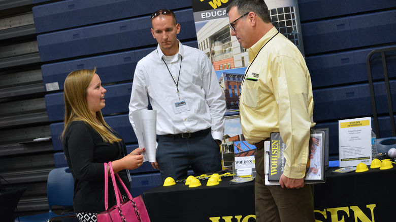 Student talks with employers at SSET career fair