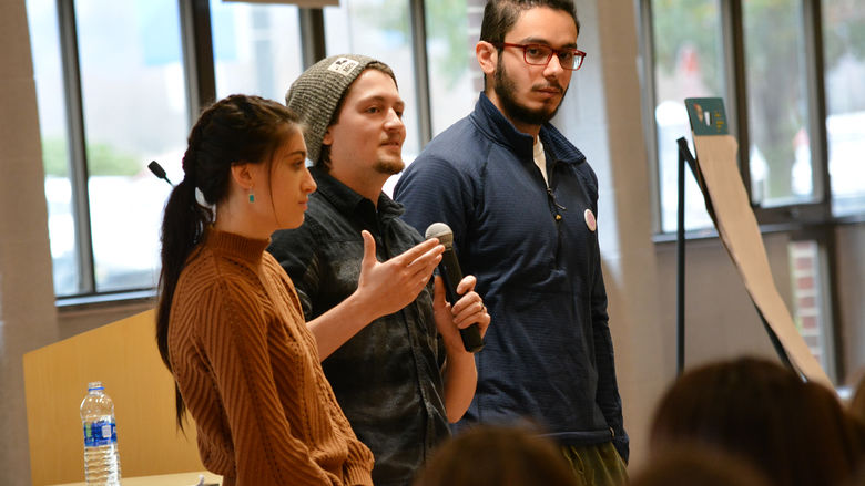 students speaking with microphone