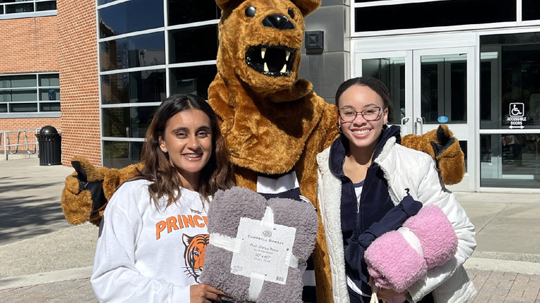 Gurleen Grewal and a friend pose with the Nittany Lion on the Harrisburg campus