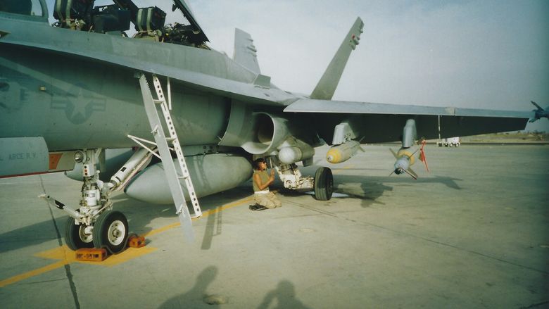 Fredericks working on an aircraft on her deployment in Kuwait.