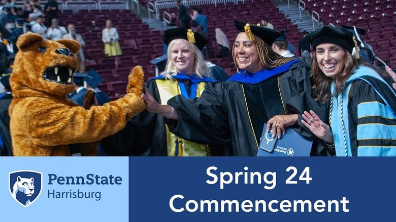 three female students in commencement regalia with the Nittany Lion