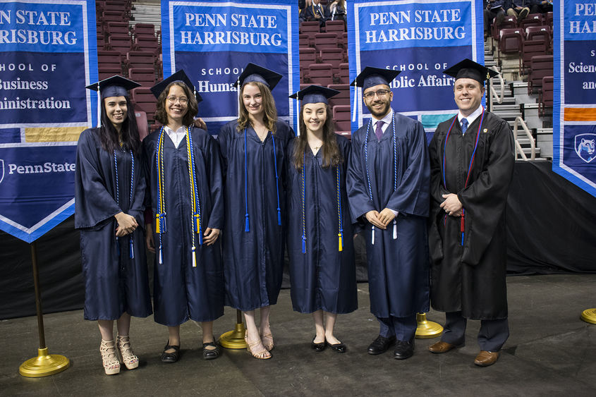 Six students in graduation regalia