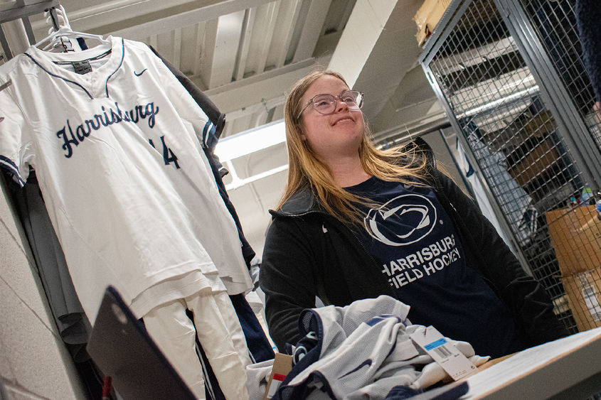 Career Studies student Maggie Kutz smiles in the equipment room at Penn State Harrisburg