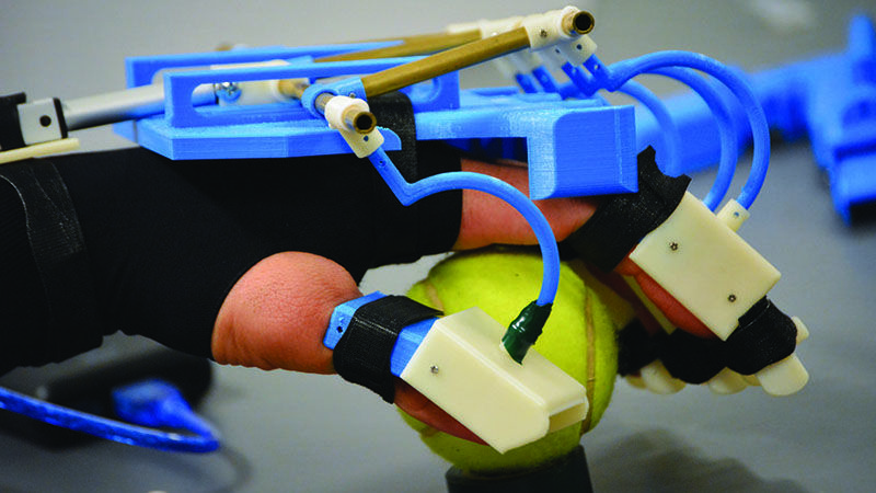 exoskeleton device for hand rehabilitation grips tennis ball