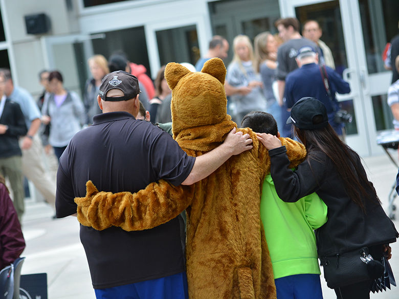 Nittany lion with students from the back