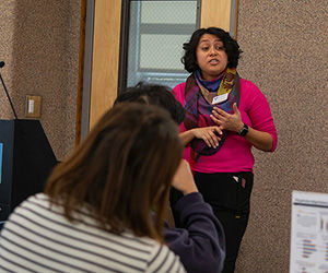 Latina staff member presenting during a workshop