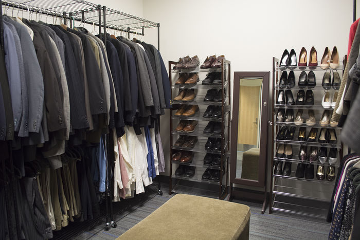 racks of clothing and shoes