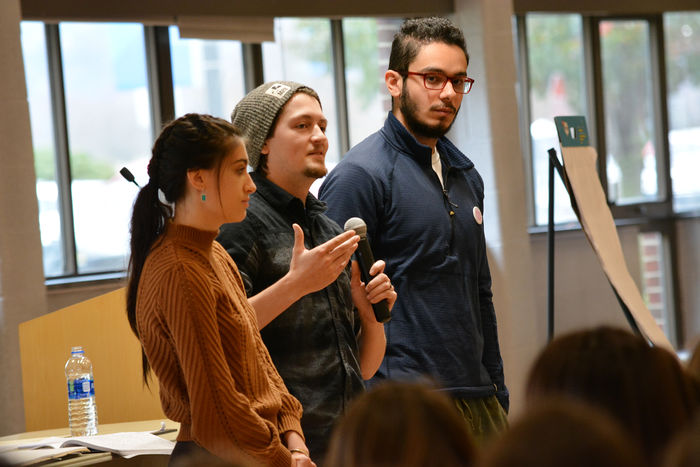 students speaking with microphone