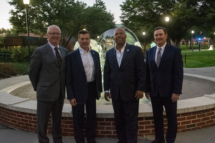 Winners of the Alumni Achievement Award gather at the fountain at Penn State Harrisburg