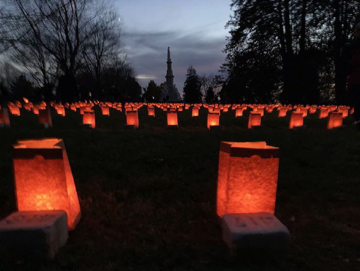 luminaries sitting on graves at Gettysburg