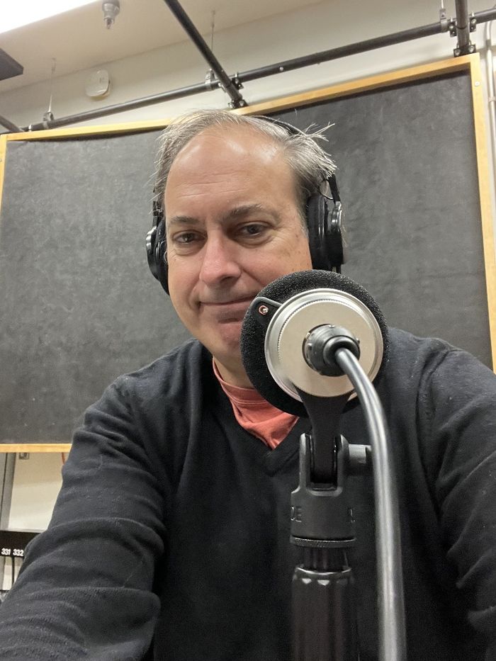 Matt Jordan recording a podcast in the studio