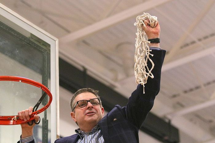 Coach Don Friday holding net