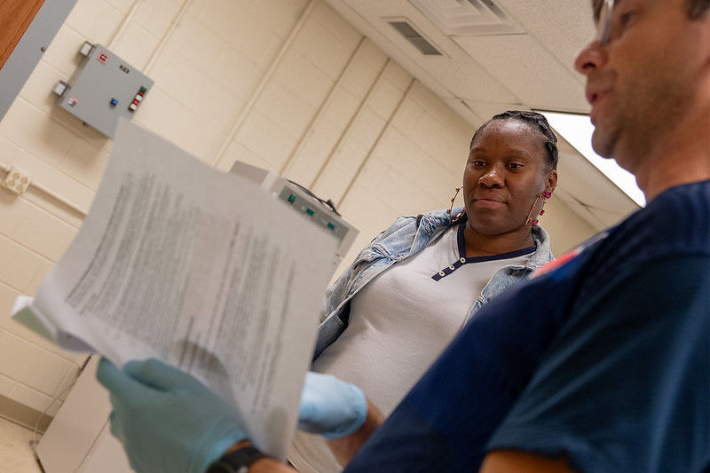 Zonnelle Hanley and Dr. Nik Tsotakos review lab results