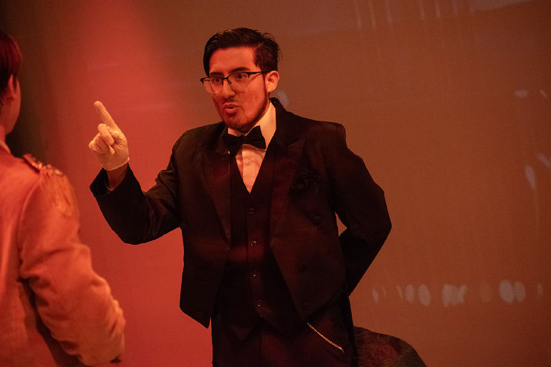 In the Penn State Harrisburg production of "Clue," a student portraying Mr. Boddy points a finger in the air