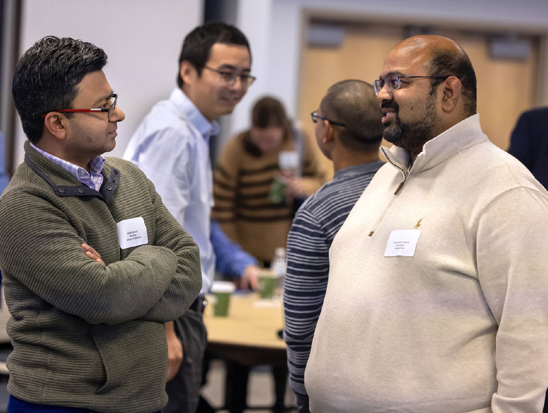 Shyam Bansal, left, from Penn State College of Medicine, talks with Anilchandra Attaluri from Penn State Harrisburg
