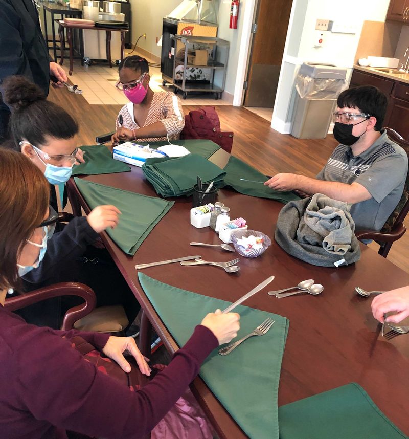 Job Shadow at Frey Village – Learning how to fold silverware 