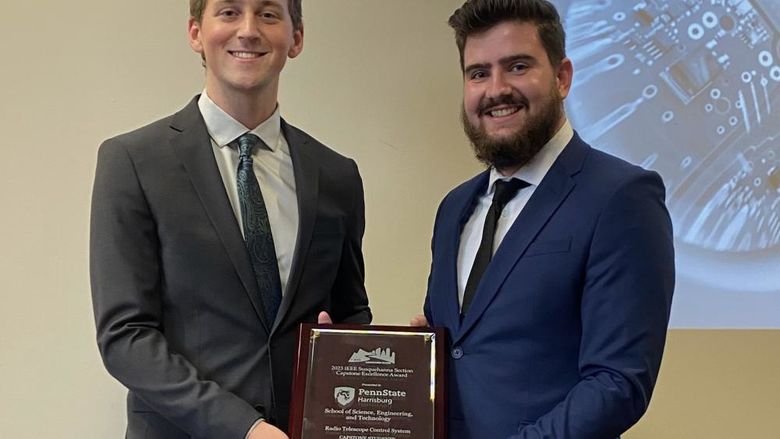 Photo of Aaron Olsen and Zachary Martin holding award from the Institute of Electrical and Electronic Engineers (IEEE) Susquehanna Section