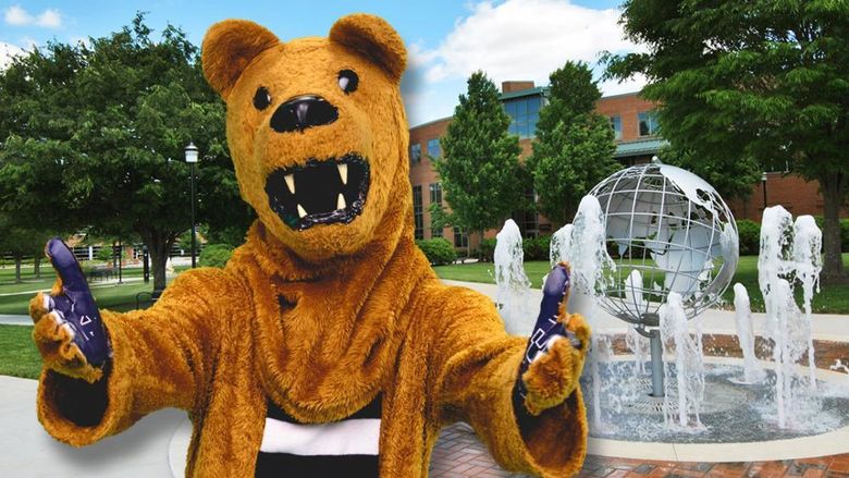 Nittany Lion Mascot in front of globe fountain on Harrisburg campus