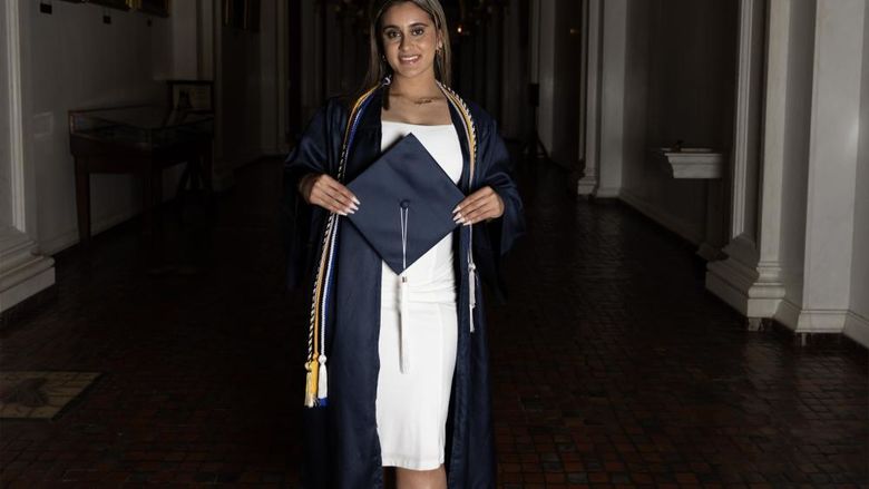 Gurleen Grewal poses at the state Capitol with her cap and gown