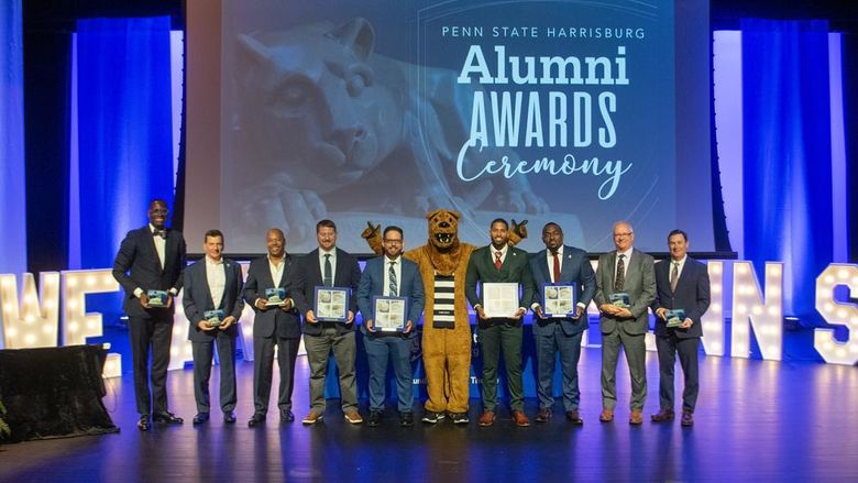 Alumni Award winners gathered onstage in the Kulkarni Theatre