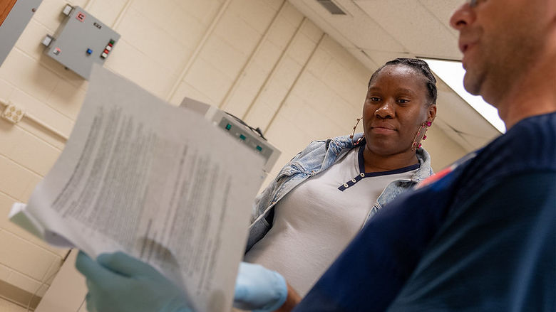 Zonnelle Hanley and Dr. Nik Tsotakos review lab results