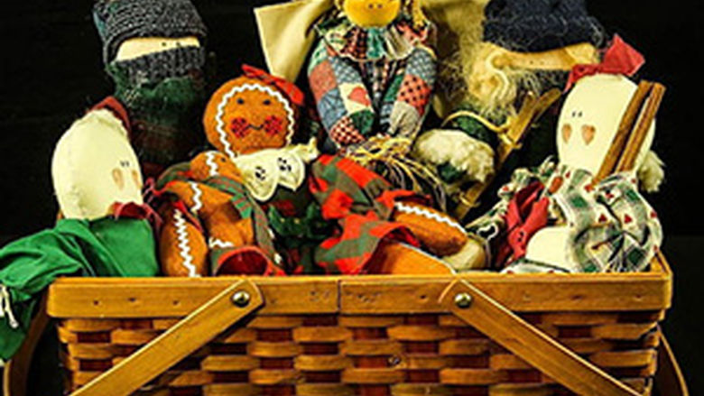 woven basket full of older, handcrafted toys