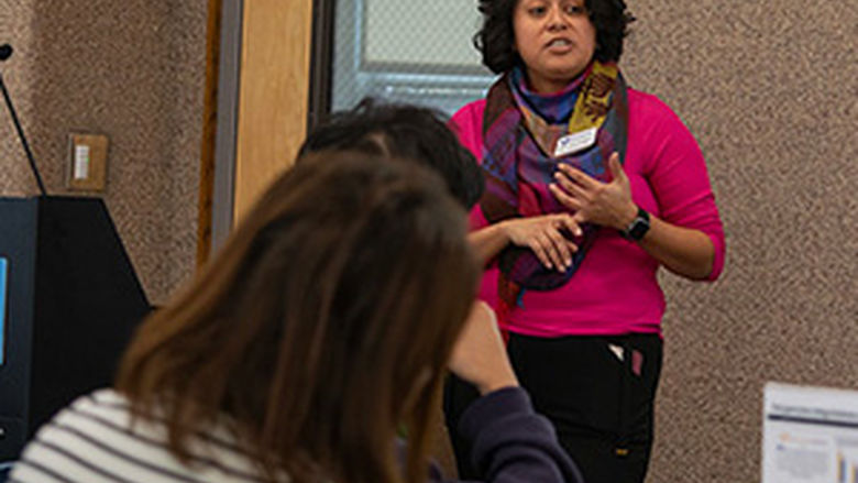 Latina staff member presenting during a workshop