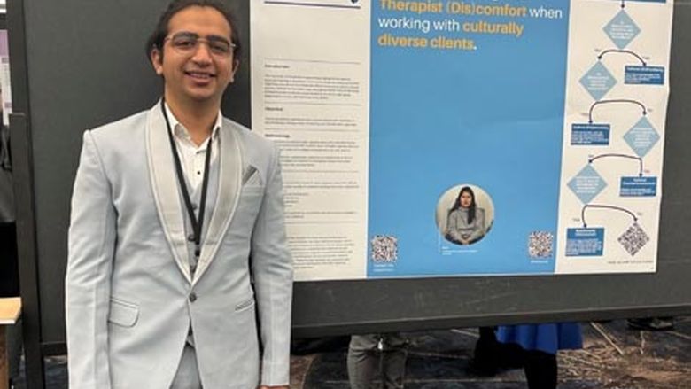 Deeaanj Hinduja with his presentation poster