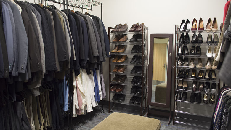 racks of clothing and shoes