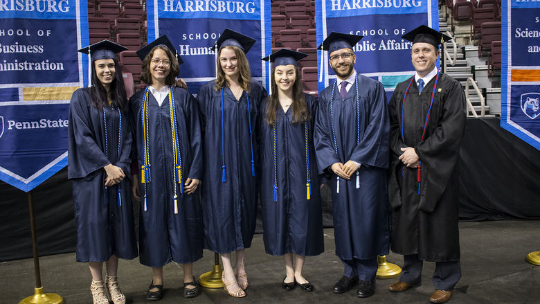 Six students in graduation regalia
