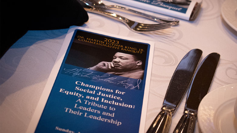 banquet program sits next to table setting