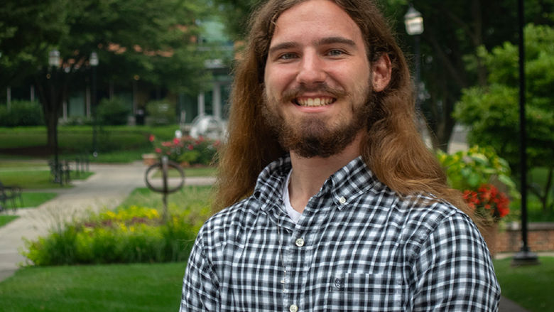 Fabian Vantassell stands on the Penn State Harrisburg campus