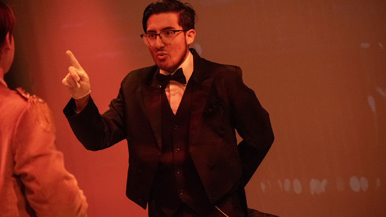 In the Penn State Harrisburg production of "Clue," a student portraying Mr. Boddy points a finger in the air