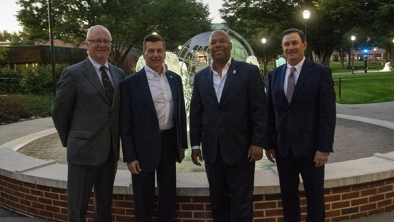 Winners of the Alumni Achievement Award gather at the fountain at Penn State Harrisburg