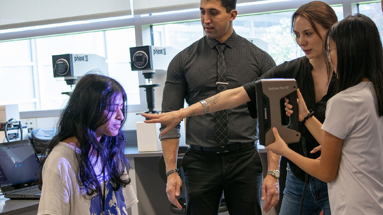 Students use a 3D Scanning device in a lab