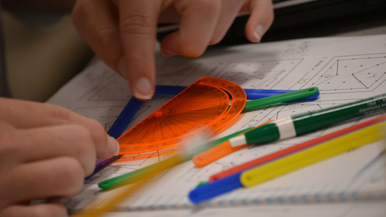 hands working with protractor