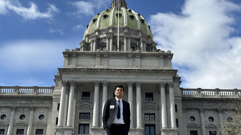 Anmol Garg stands in front of the state Capitol