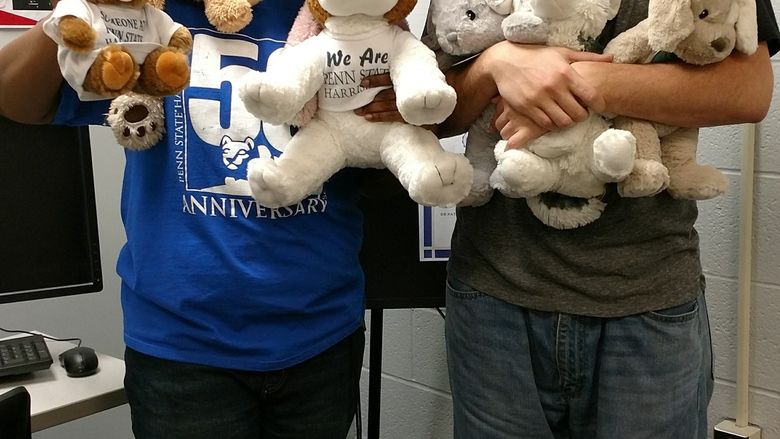 students with teddy bear donations