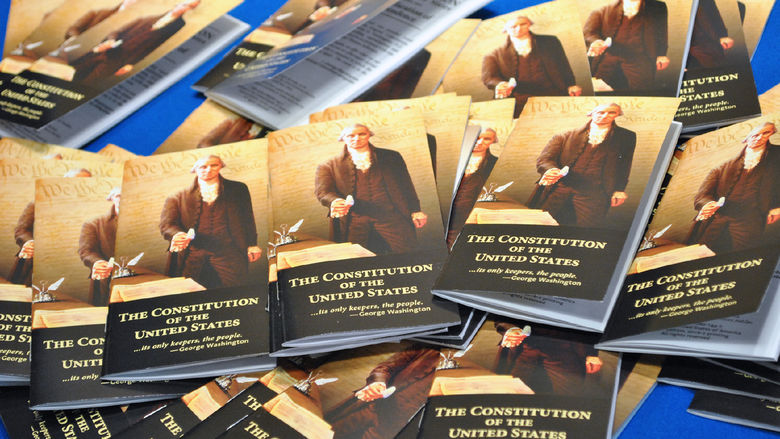 pile of mini Constitution books