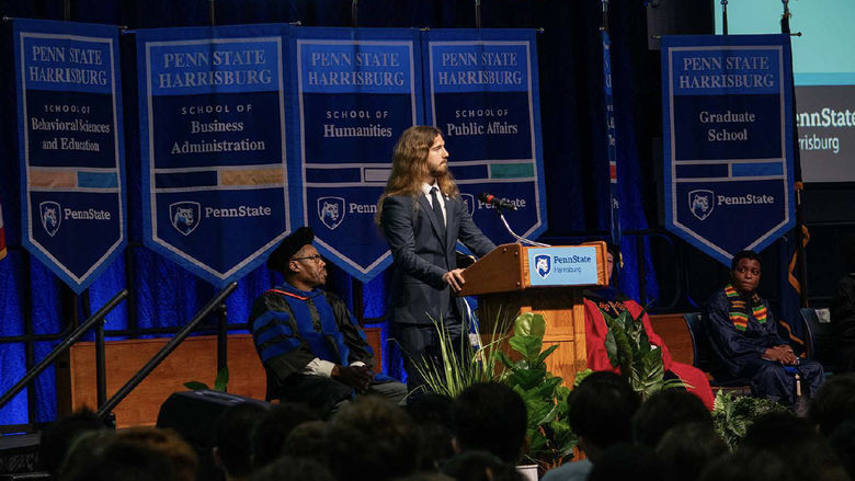 Fabian Vantassell speaks from a lectern