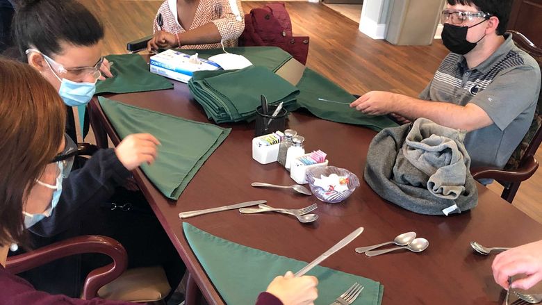 Job Shadow at Frey Village – Learning how to fold silverware 