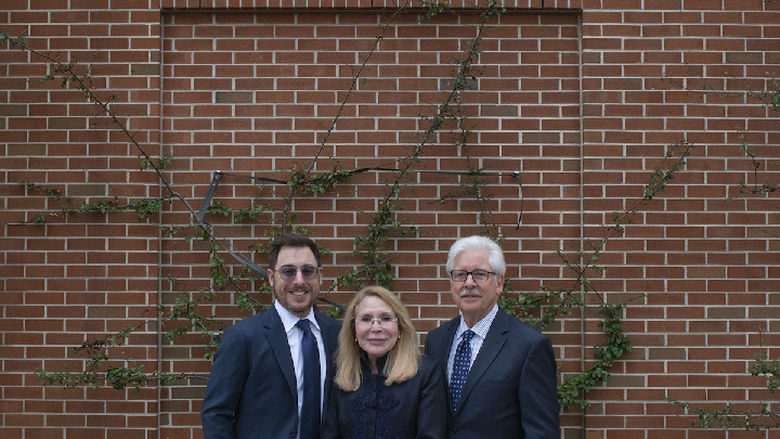 Madlyn Hanes, joined by son Michael R. Hanes and husband Michael L. Hanes, at the naming of the Harrisburg campus library in her honor