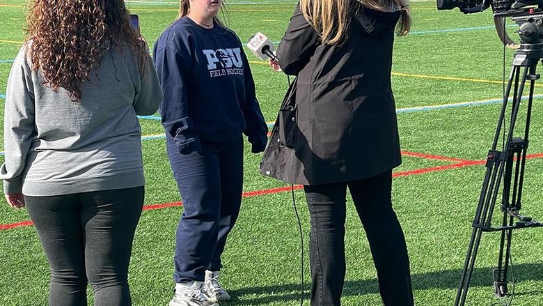 Maggie getting interviewed for being a part of Field Hockey