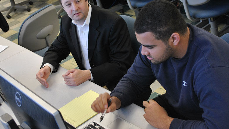 A faculty member mentors a college student
