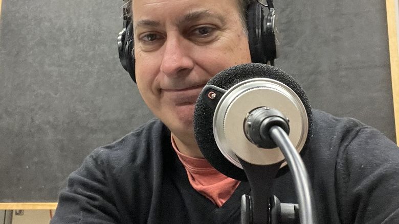 Matt Jordan recording a podcast in the studio