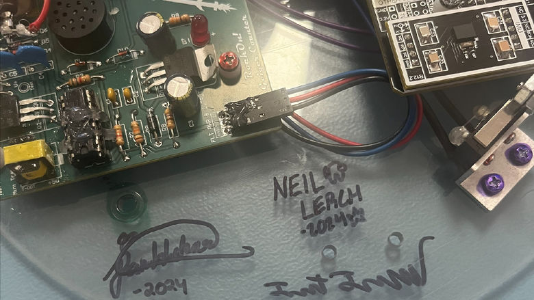 Students signed their names on the scientific payload they sent to space through the NASA Rock On program