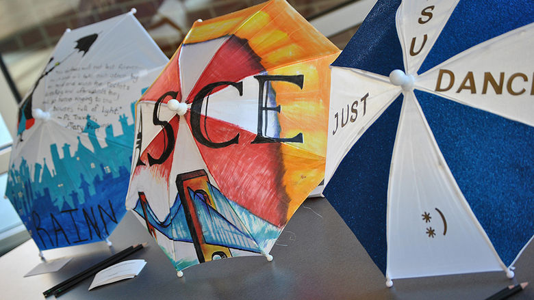 Umbrellas decorated by classes and student clubs/organizations in the RAINN Day theme.