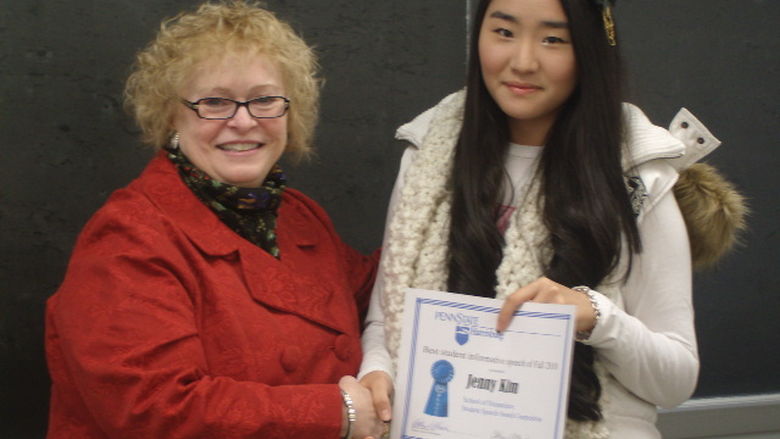 School of Humanities Director Kathryn Robinson presents the Fall 2010 Student Speech Award to Jenny Kim